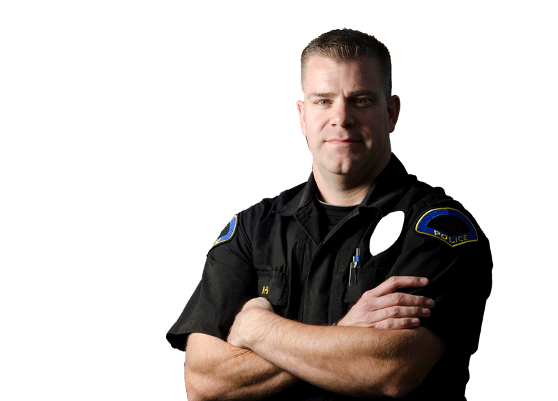Smiling police officer with his arms crossed